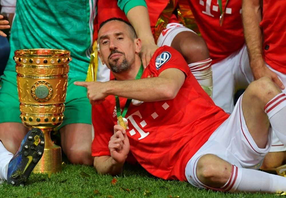 Franck Ribery poses with the DFP Pokal trophy. AFP