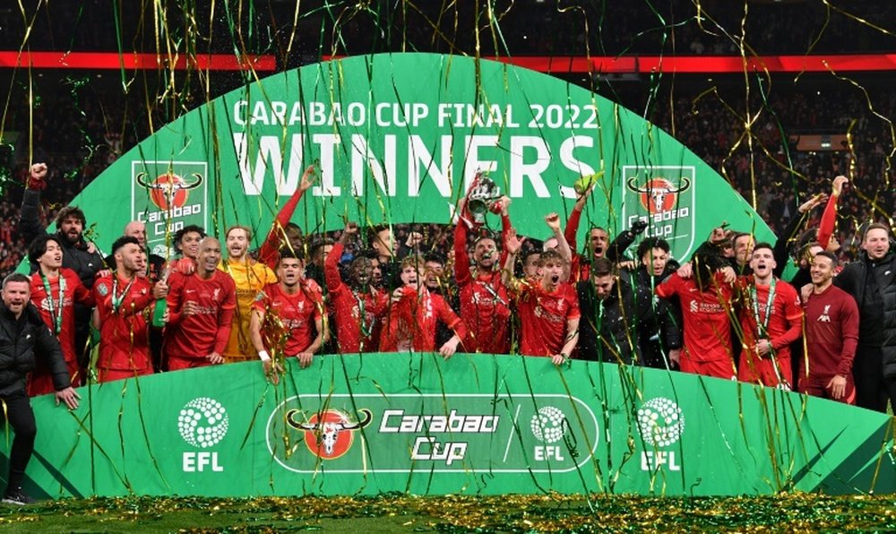 Liverpool players celebrate winning the League Cup final. AFP