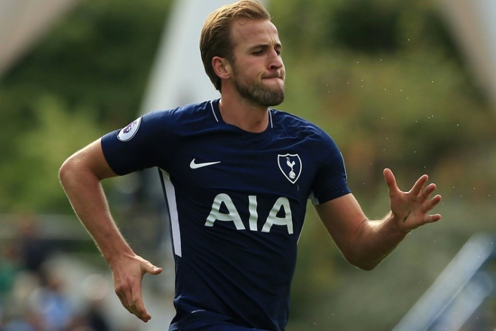 Kane moved on to six Premier League goals for the season against the 'Terriers'. AFP