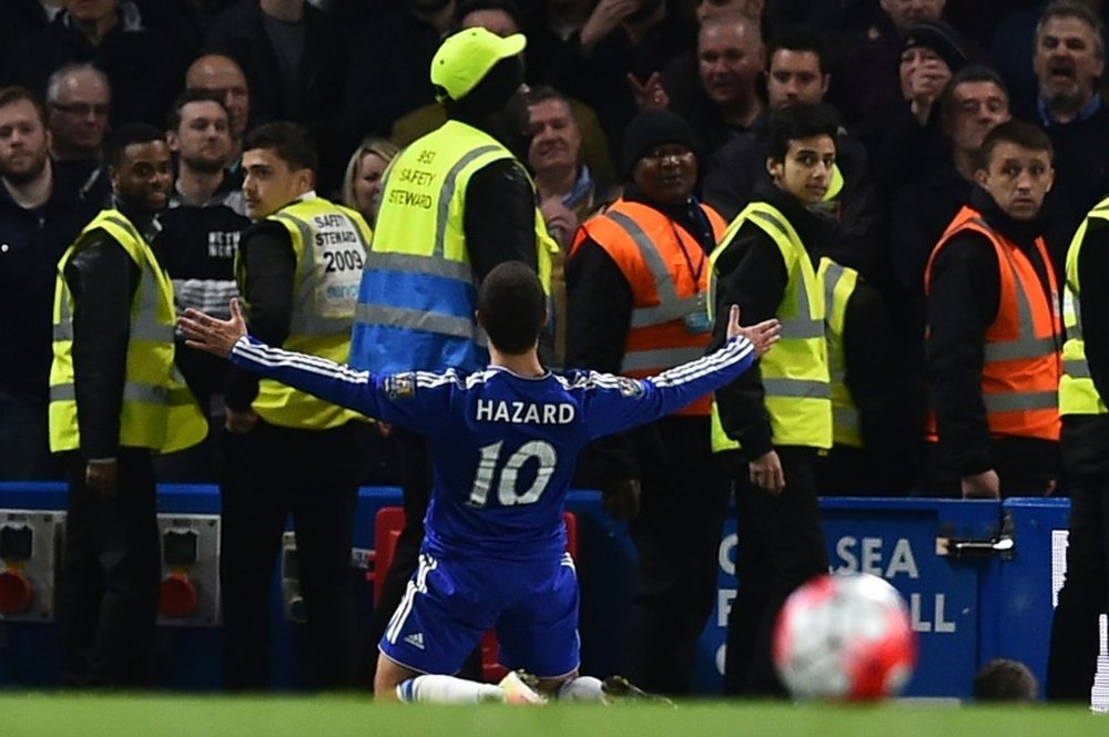 Hazard celebrates scoring against Tottenham last season. AFP