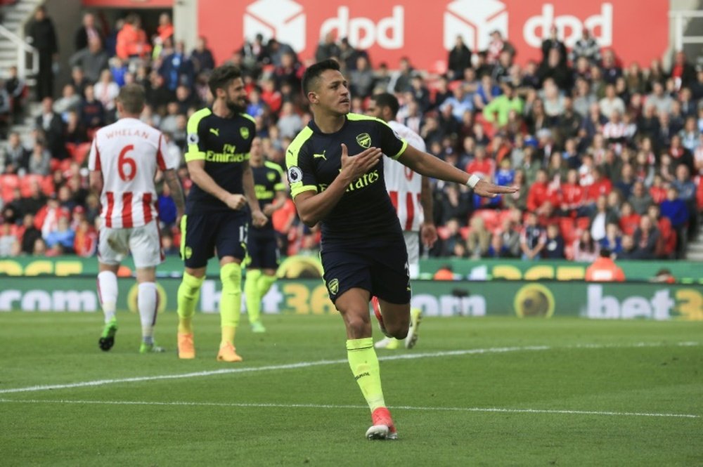 Wenger praises 'fighter' Sanchez for playing through the pain. AFP