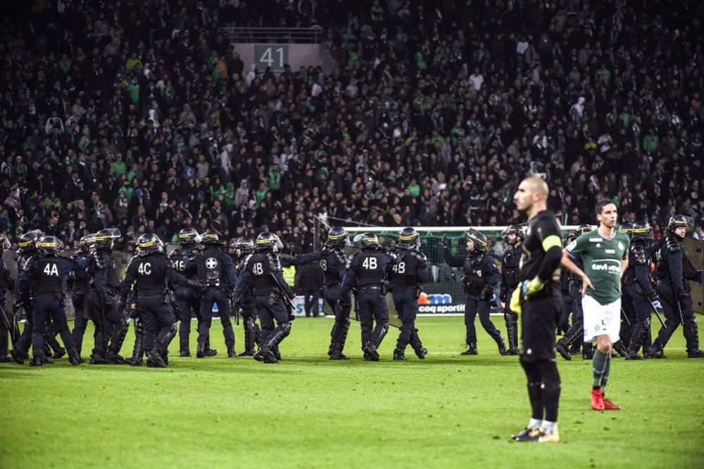 There was crowd trouble as Saint-Etienne were thrashed by fierce rivals Lyon. AFP