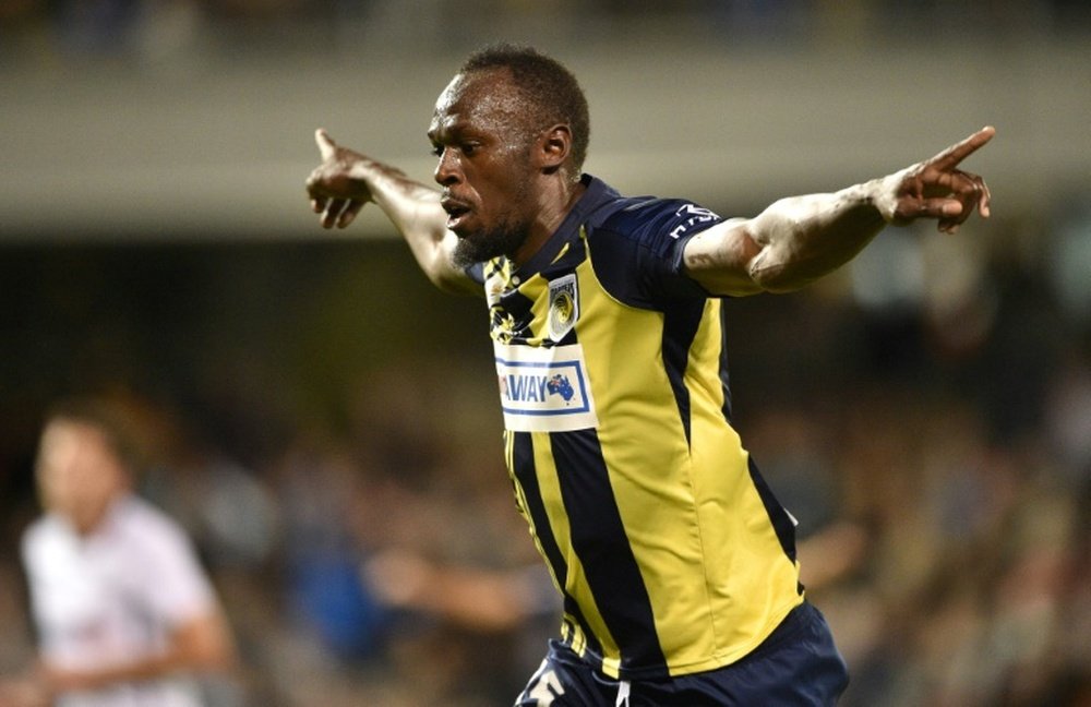 Bolt celebrates scoring for Central Coast Mariners in October. AFP