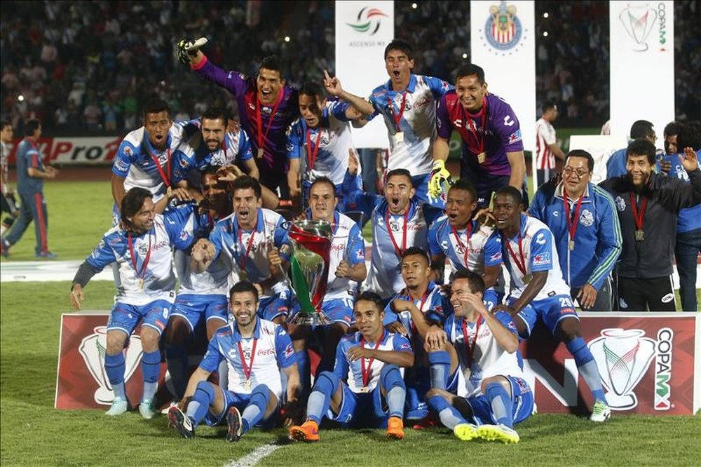 Jugadores de Puebla FC celebran su triunfo en  la final del torneo clausura de la Copa MX. EFE/Archivo