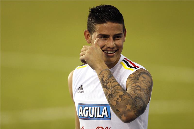 A tattoo is visible on the leg of Colombia's James Rodriguez as he warms-up  before a Copa America Group B soccer match at the Arena Fonte Nova in  Salvador, Brazil, Saturday, June