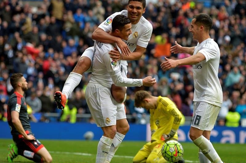 Casemiro laughing and celebrating a goal with Ronaldo. AFP