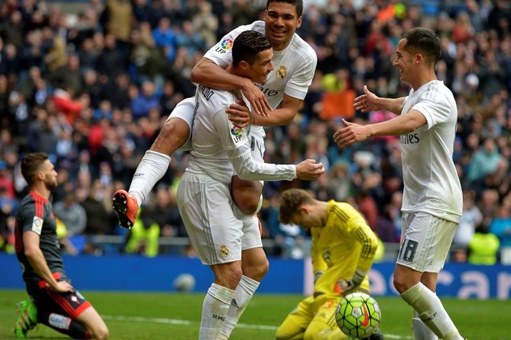 Casemiro laughing and celebrating a goal with Ronaldo. AFP