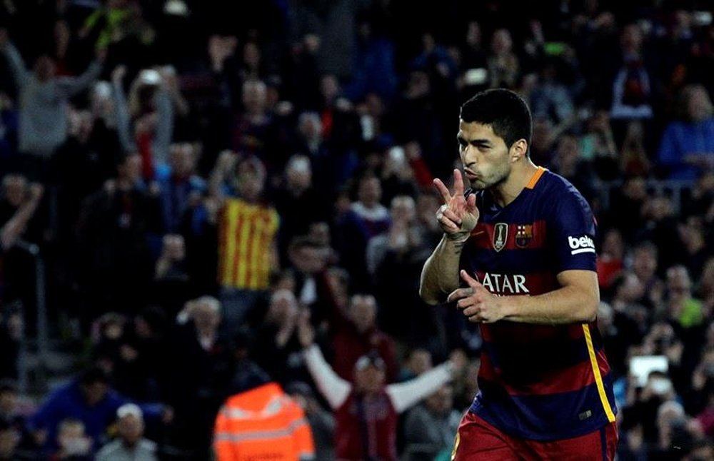 Luis Suarez celebrates after scoring his third goals at Camp Nou, Barcelona. EFE