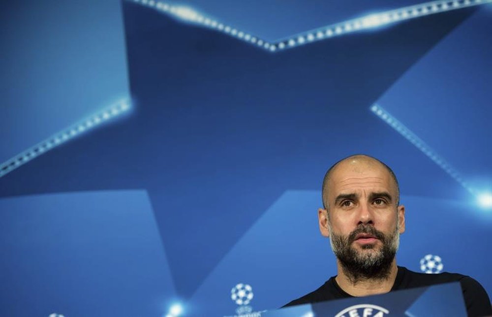 Guardiola accepted to earn less money. AFP