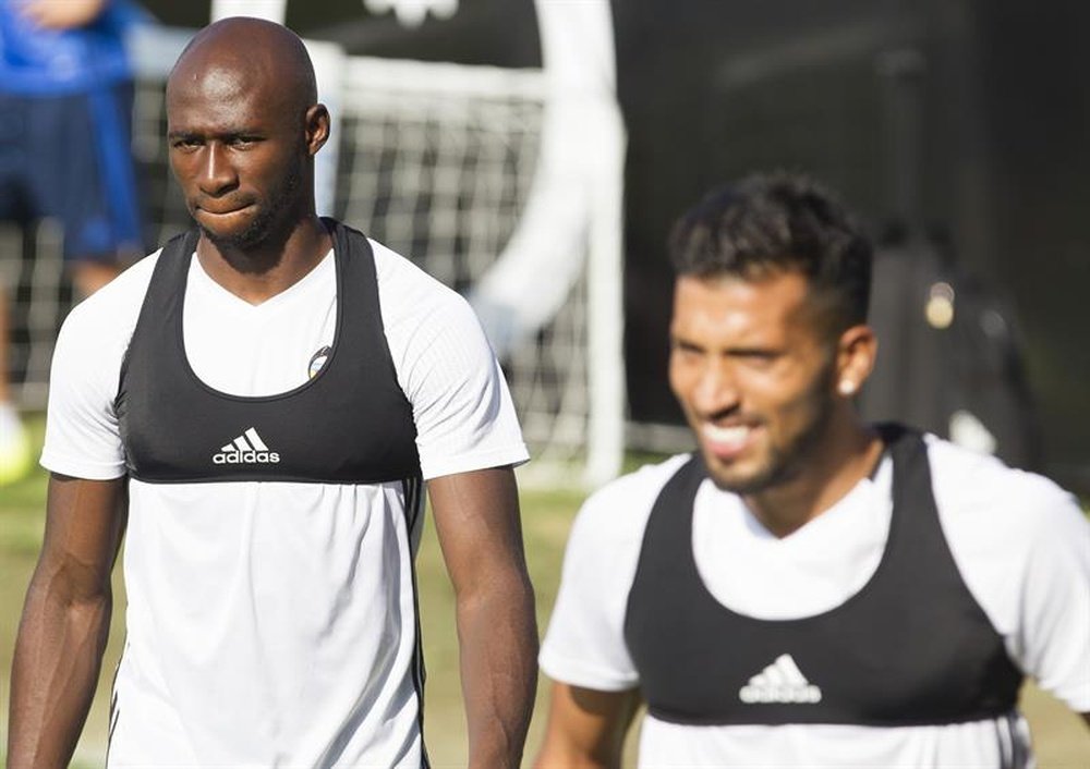 Valencia players with aa bra. AFP