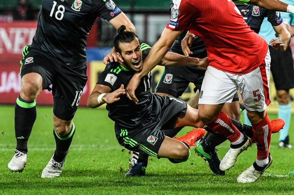 Bale falling during the match. AFP