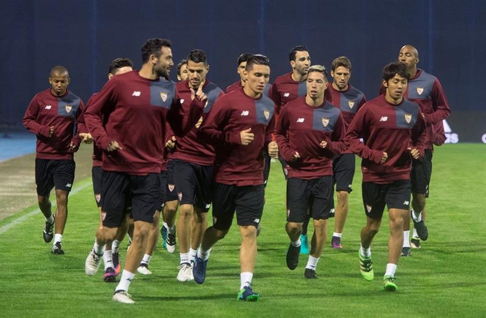 Sevillas players run during a training session at the Maksimir stadium in Zagreb, on October 17, 2016