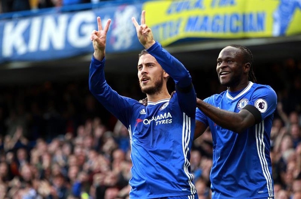 Eden Hazard and Moses celebrating a goal. AFP