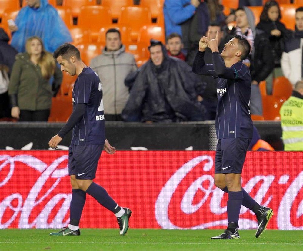 Le milieu du Malaga célèbrent un but contre Valence en Liga. AFP