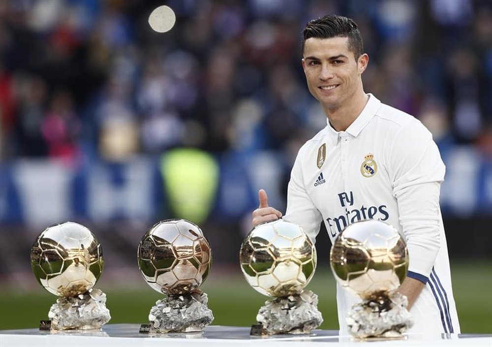 Ronaldo with his four Ballon d'Or's. EFE