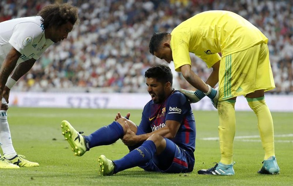 Jogador do Barça lesionou-se frente ao Real Madrid. EFE