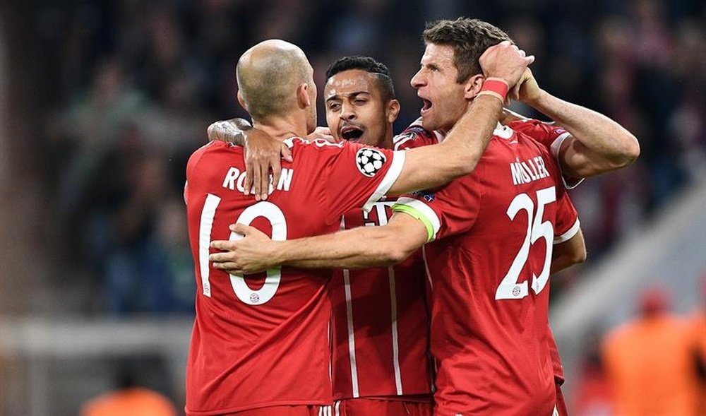 Muller, Thiago et Robben célèbrent un but en C1. AFP