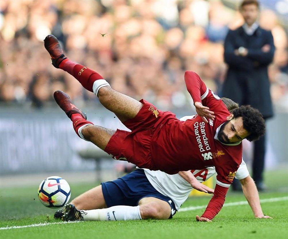 Liverpool's Mohammed Salah is tackled during his side's 4-1 away loss to Tottenham last season. AFP