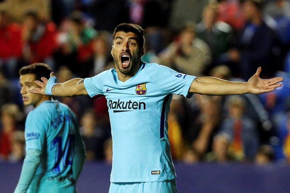 It was not easy persuading some people at Barca to sign Suarez. AFP