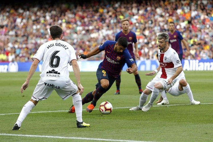 Barca hit Huesca for eight