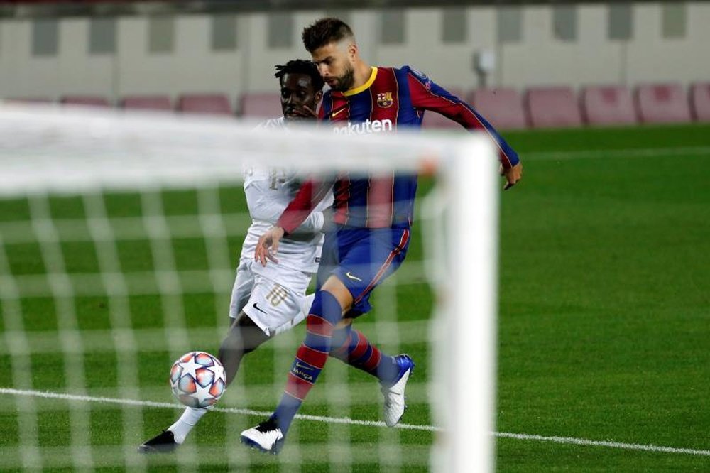 Pique (R) is one of Barca's best central defenders ever. EFE