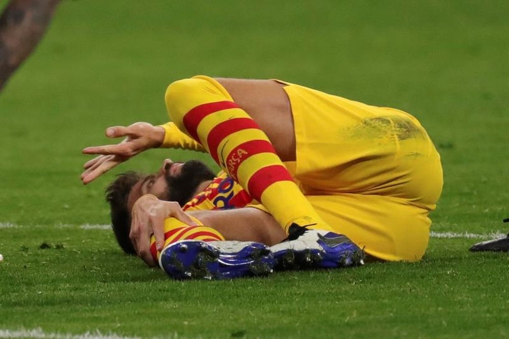 Piqué tem uma grave entorse de ligamentos. EFE / Juanjo Martín