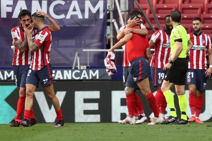 Late double strike sees Atletico stay in pole position