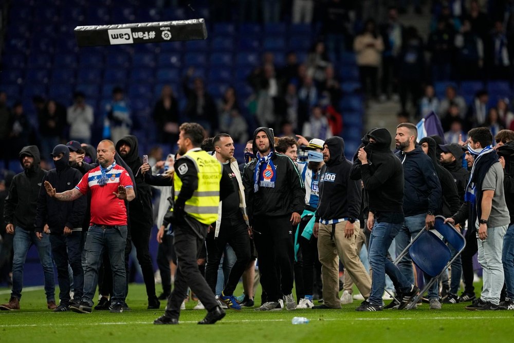 Espanyol fans invaded the pitch after the game. EFE