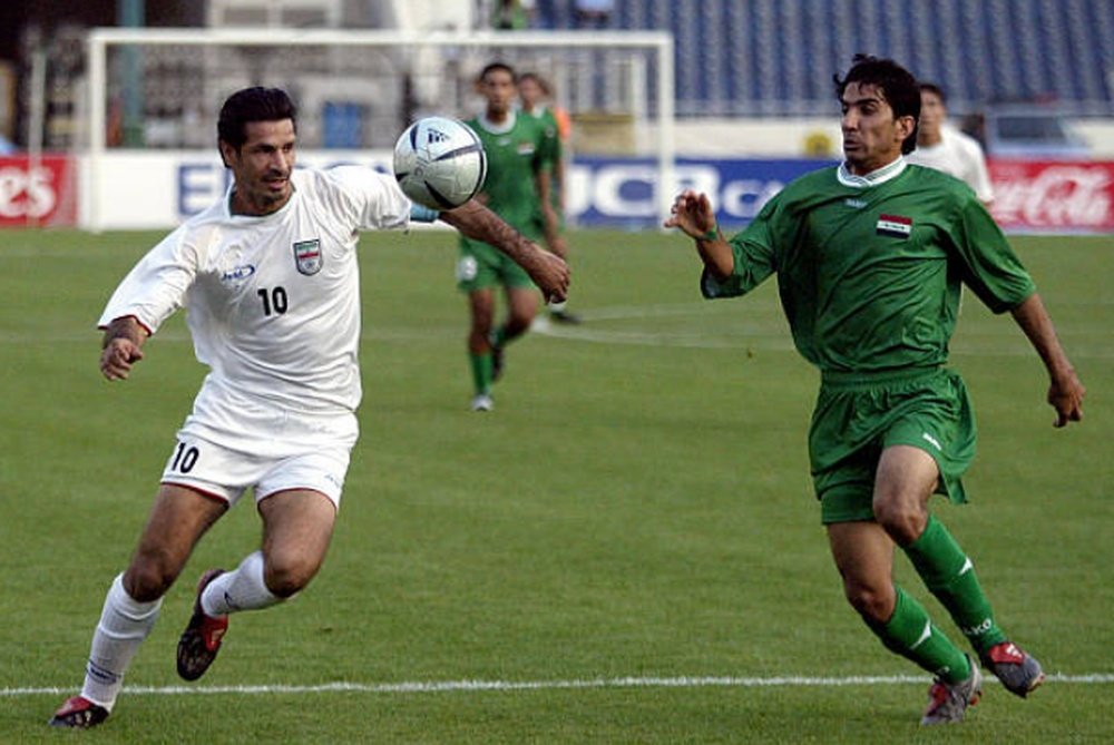 Ali Daei, a la izquierda, dejó la Selección Iraní con 109 goles anotados. AFP/Archivo