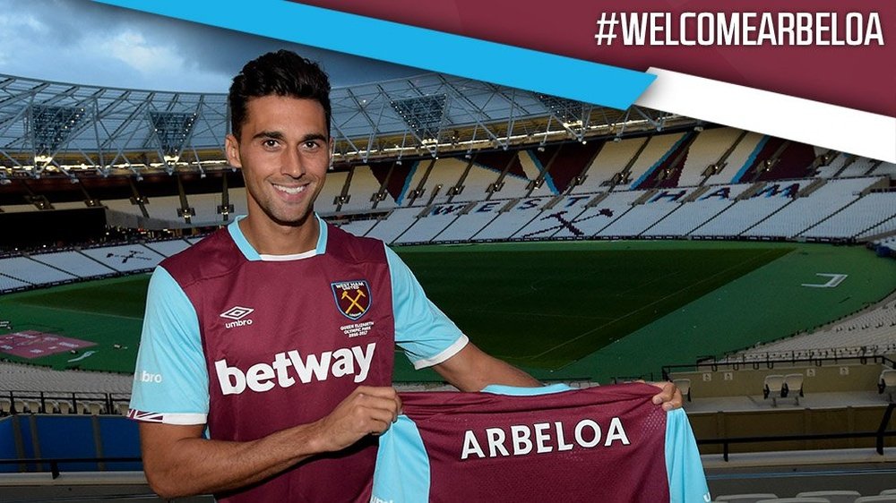 Arbeloa poses for photos at his new club's stadium. WestHam