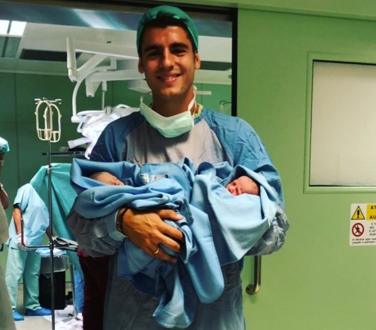 Morata holding his baby twins Leonardo and Alessandro. Instagram/AlvaroMorata