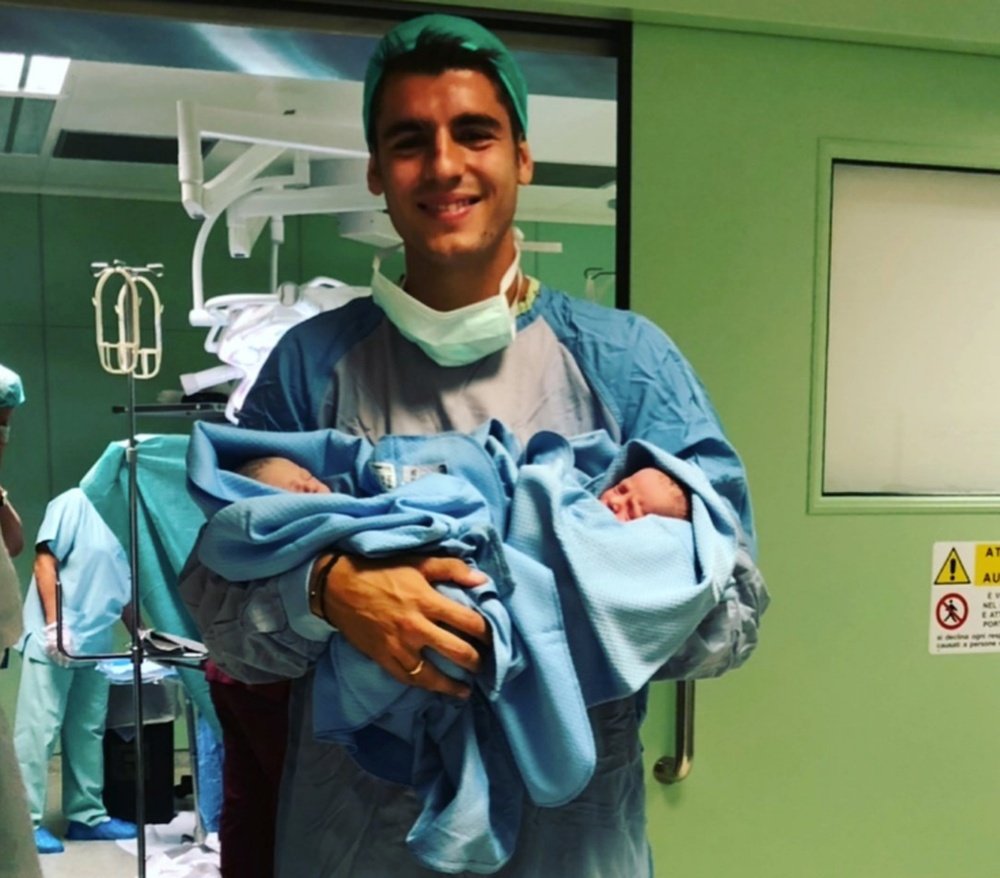 Morata holding his baby twins Leonardo and Alessandro. Instagram/AlvaroMorata
