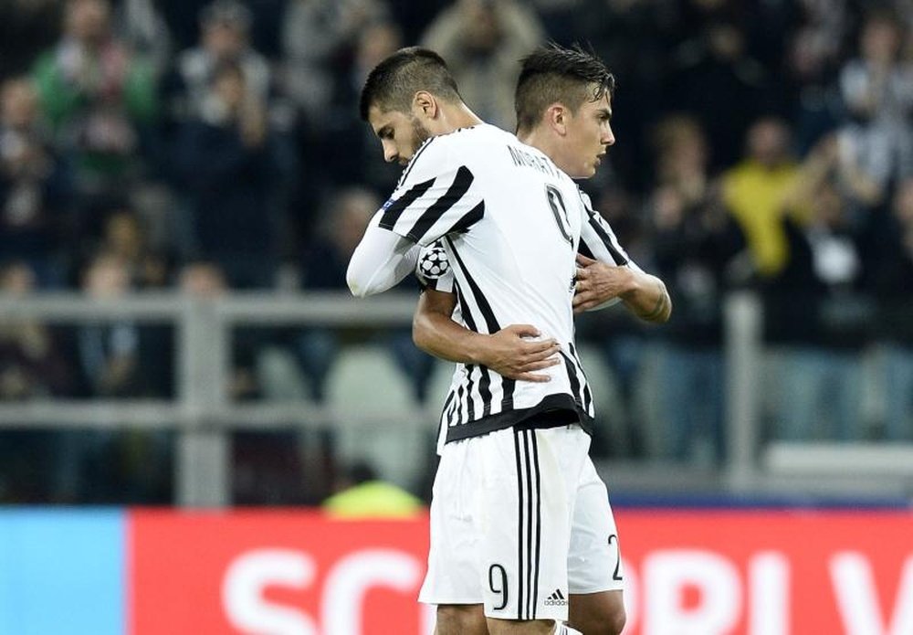 Alvaro Morata's Juve future could depend on Paulo Dybala. EFE/AFP