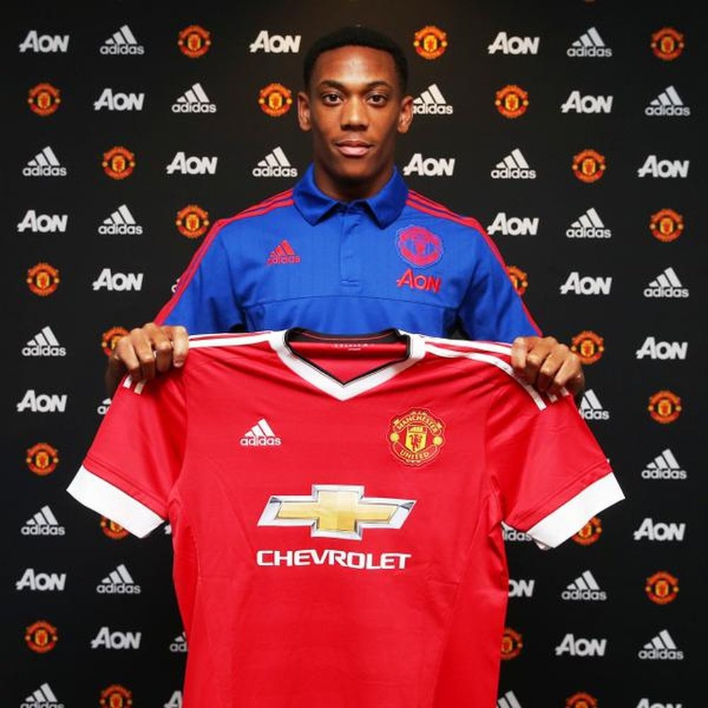 Anthony Martial holding United colours. Twitter