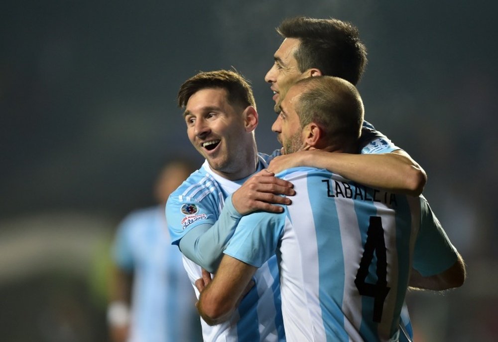 Argentina Javier Pastore (C) celebrates with teammates Lionel Messi (L) and Pablo Zabaleta after scoring against Paraguay during their Copa America semi-final match in Concepcion, Chile, on June 30, 2015.