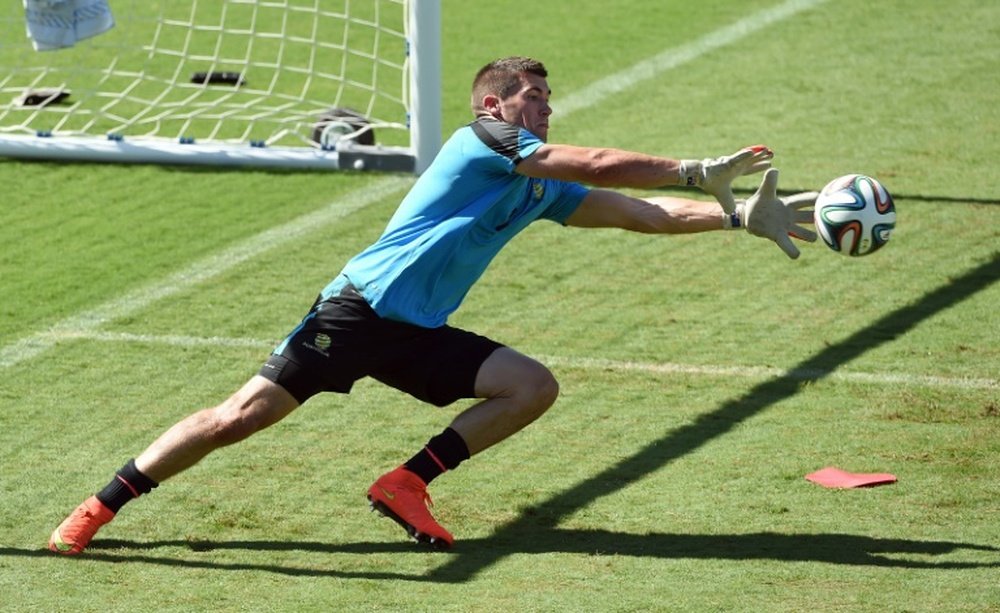 Australia goalkeeper Matthew Ryan makes a save during a training session in Vitoria, Brazil, on June 9, 2014