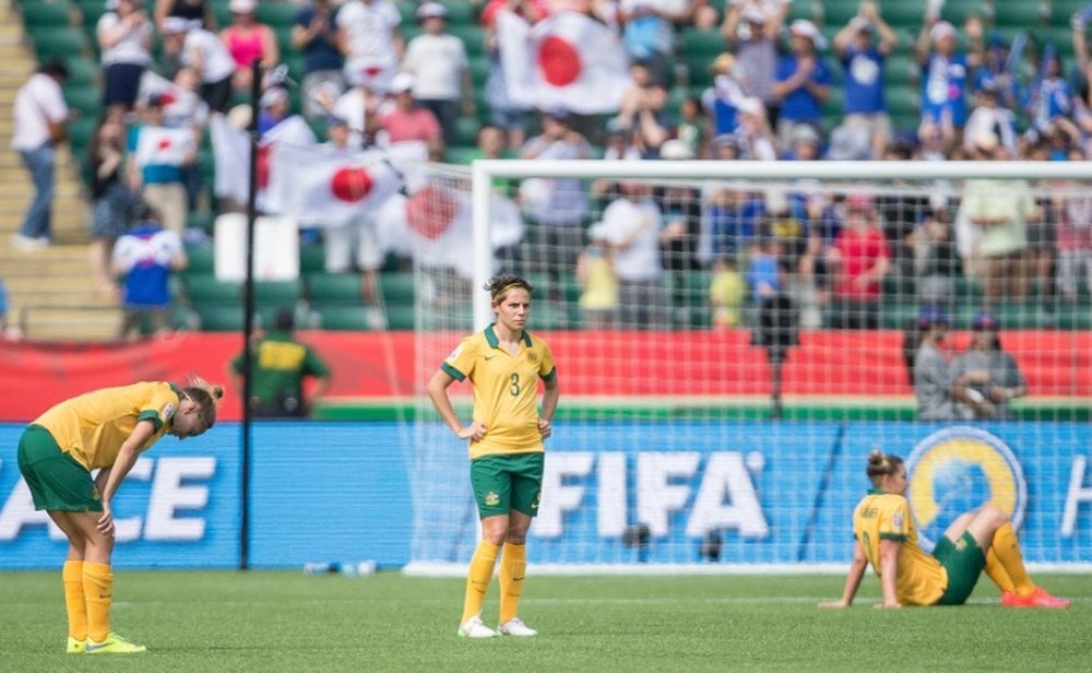 Australian players react to their 1-0 loss to Japan after their quarter-final football match in Edmonton, Alberta on June 27, 2015