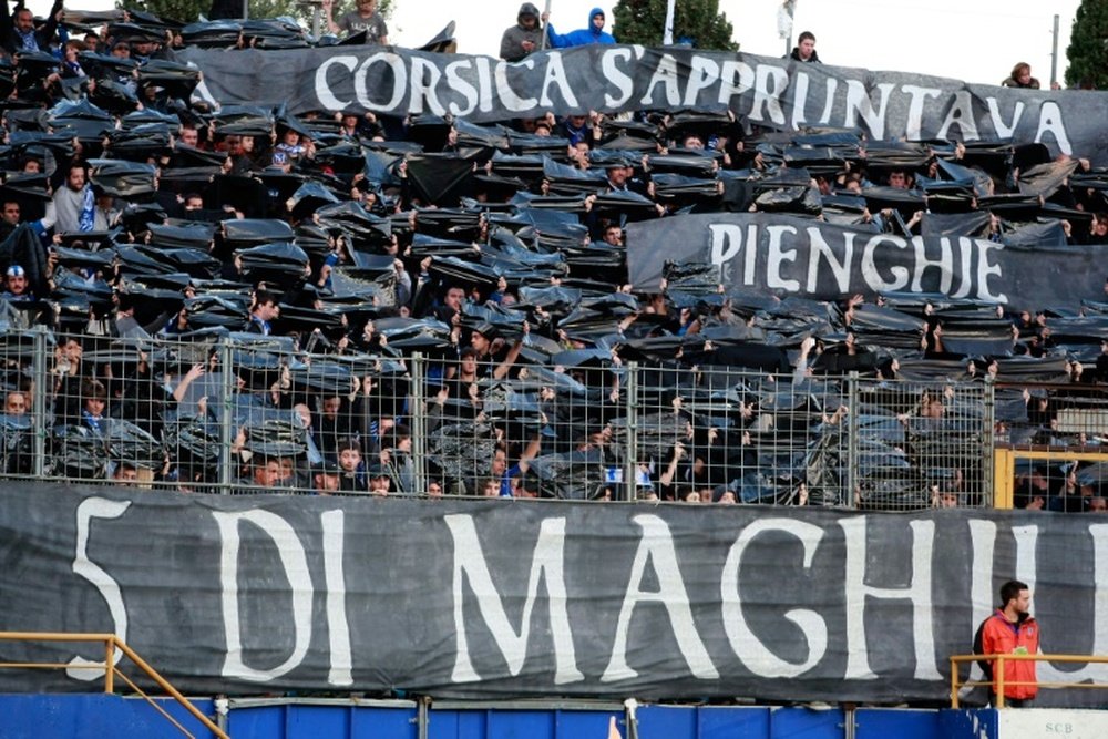 Bastia supporters hold black banners as they pay respect to the victims of the Furiani Stadium tragedy before the French L2 football Bastia vs Metz in the Armand Cesari stadium in Furiani, French Corsican island, on May 1, 2012