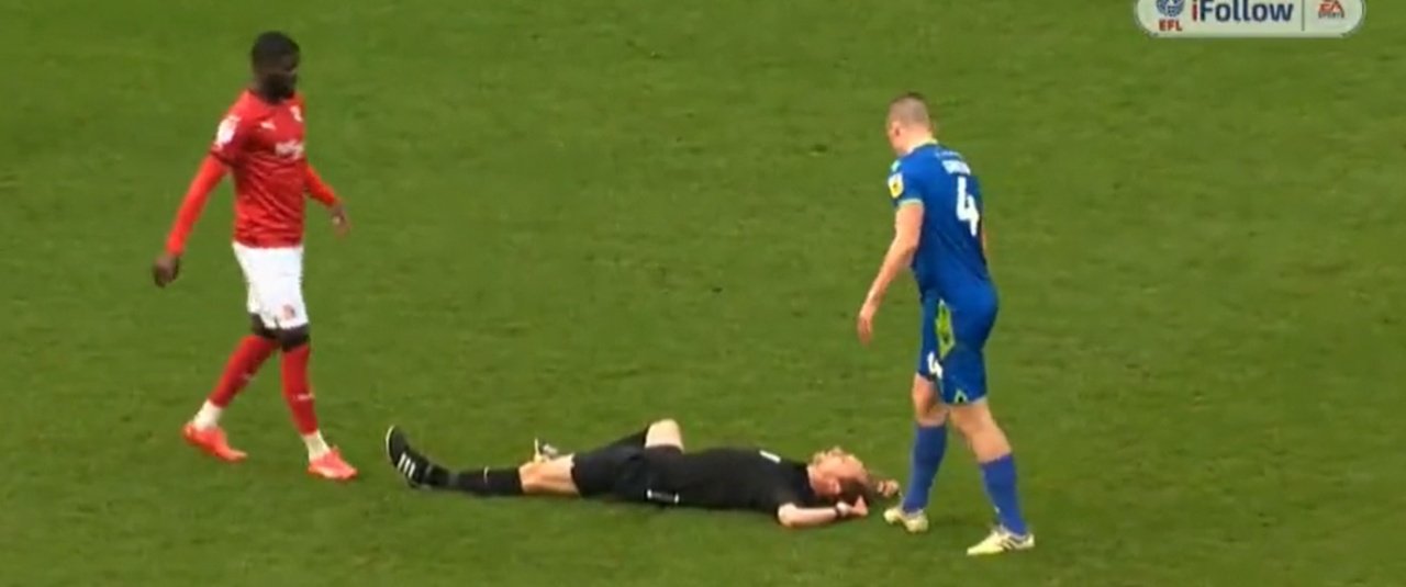 Referee Sam Purkiss was taken off on a stretcher in Swindon's game with Grimsby. Screenshot/Sky