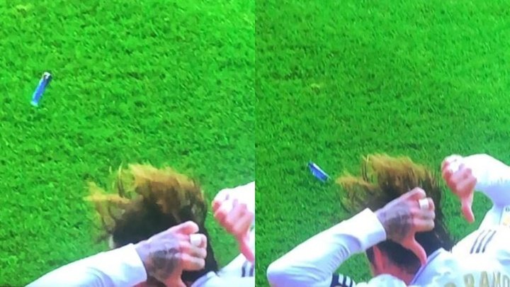Ramos celebrates goal and has lighter thrown at him