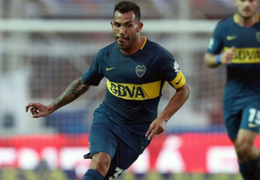 Tevez is anything but a football fanatic. AFP