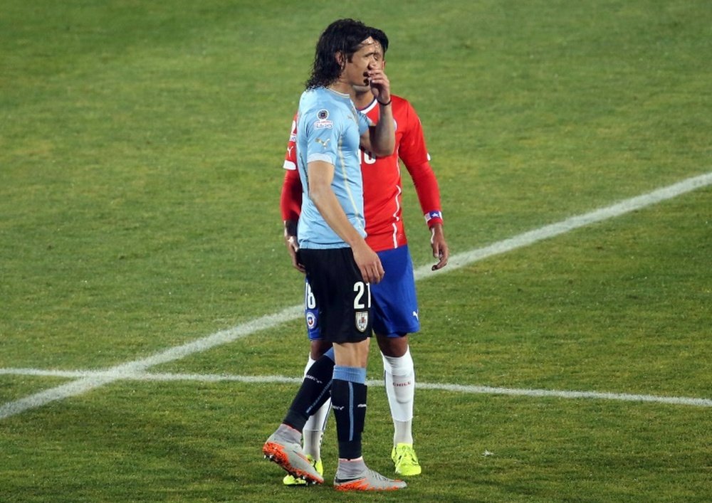 Chile defender Gonzalo Jara (back) provokes Uruguay Edinson Cavani during their Copa America 2015 quarterfinals football match in Santiago, on June 24, 2015
