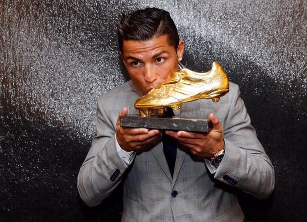 Cristiano Ronaldo, with one of his Golden Boots. Twitter