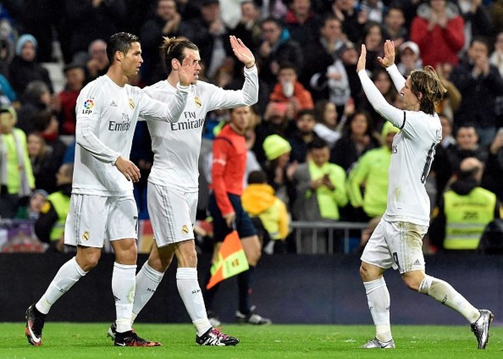 Cristiano Ronaldo et Gareth Bale célèbrent un des buts avec Luka Modrid. AFP