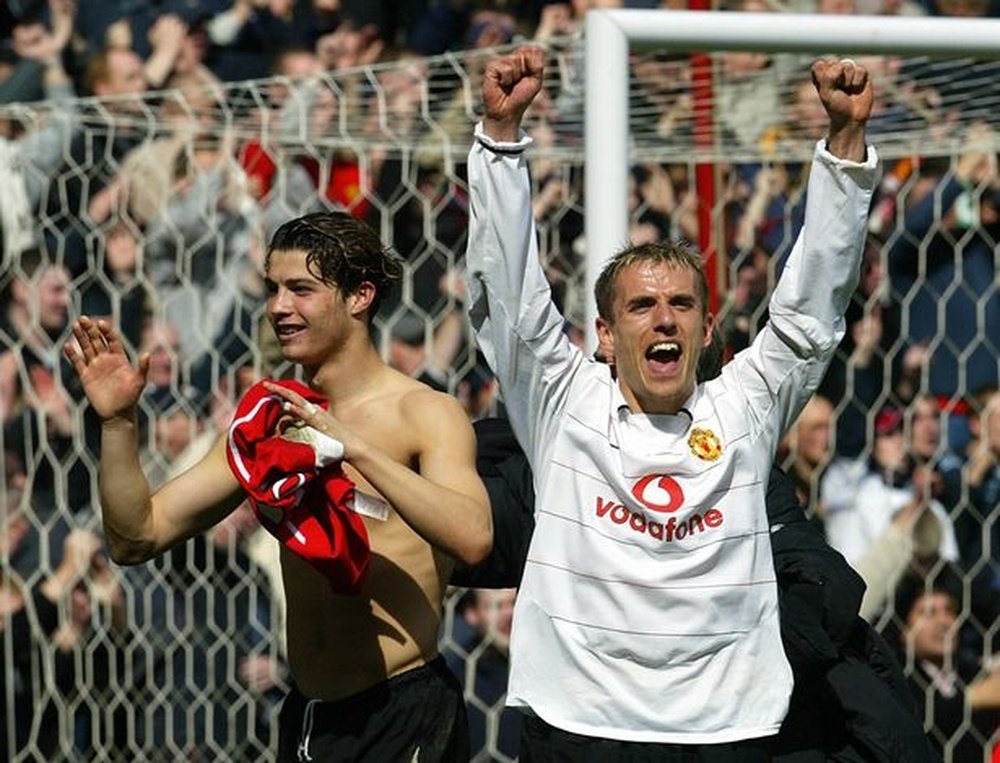 Cristiano Ronaldo and Phil Neville at Manchester United. AFP