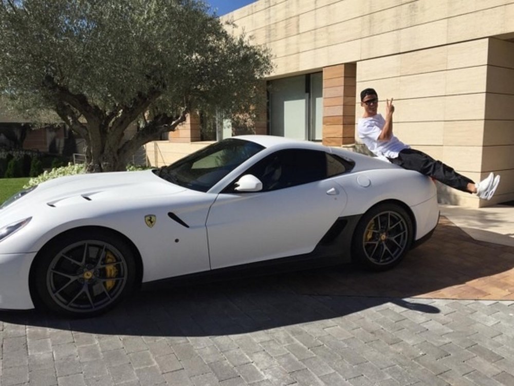 Cristiano with one of his cars. Cristiano