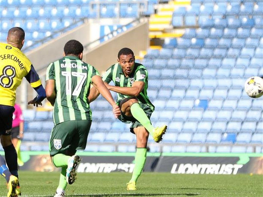 Darius Charles scores against Oxford United. AFCWimbledon