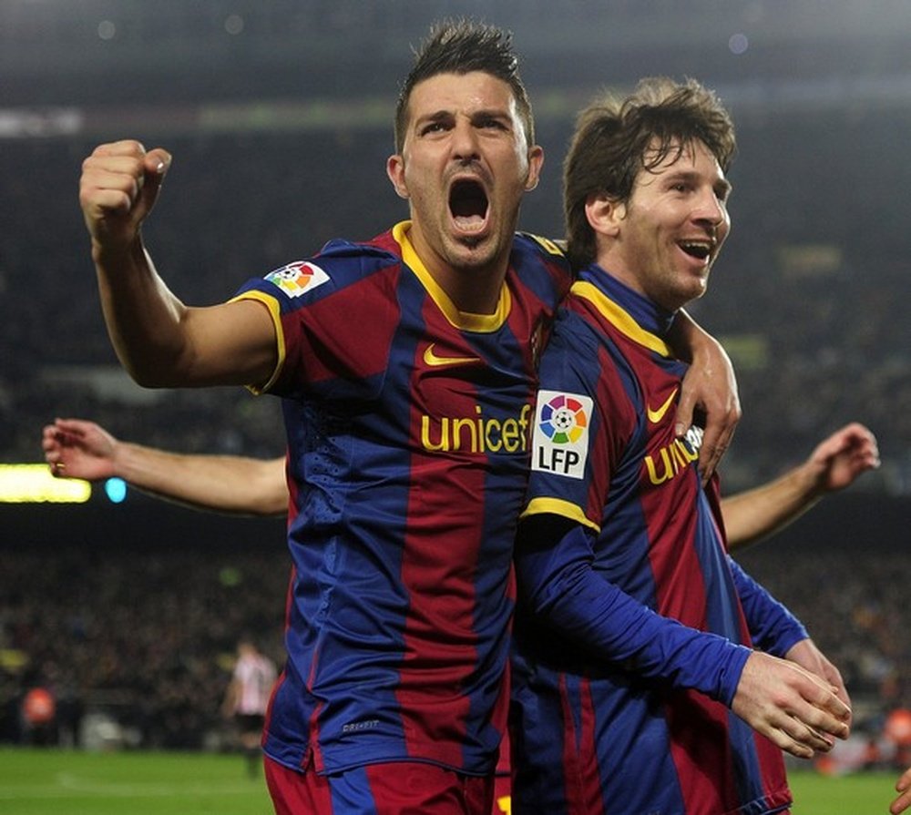 Vila celebrating with Messi during his spell at Barcelona. AFP