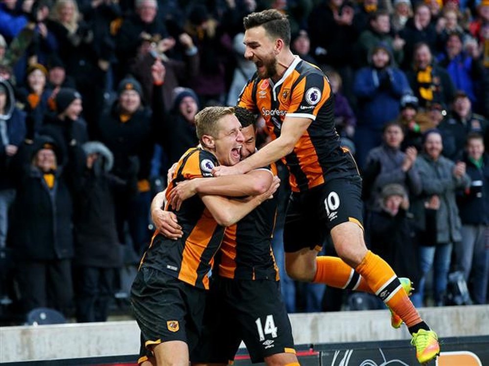 Dawson, Livermore and Snodgrass celebrate Hull's winning goal. HullCityTigers