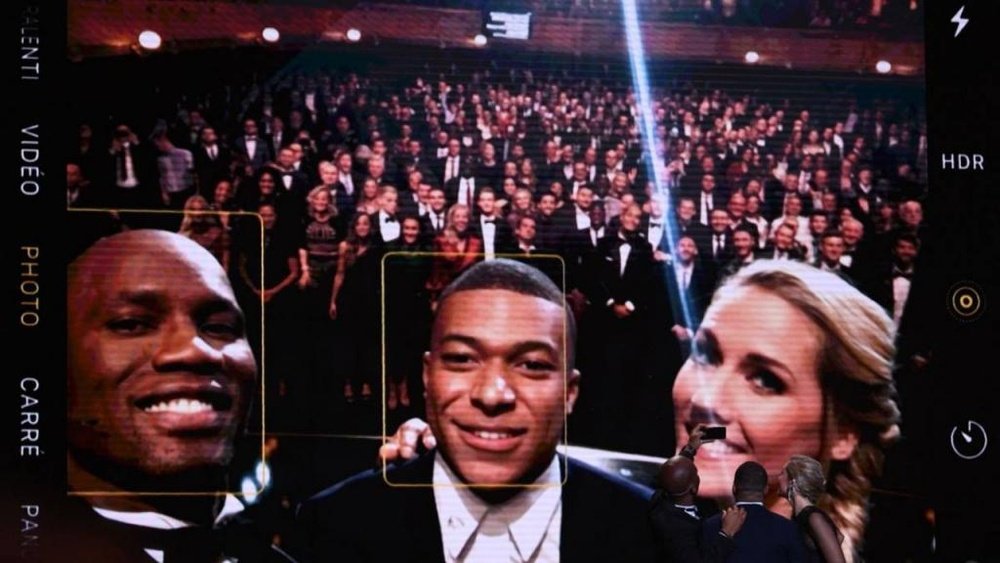Drogba took a selfie with everyone. AFP
